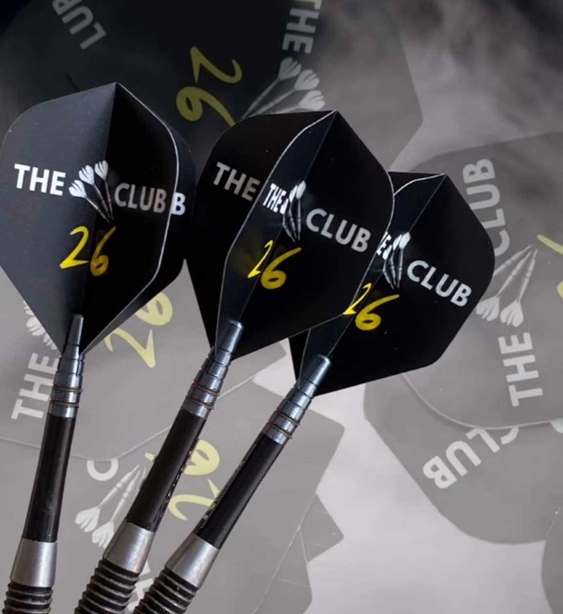 The 26 Club flights on three darts, with smoke and more flights scattered behind